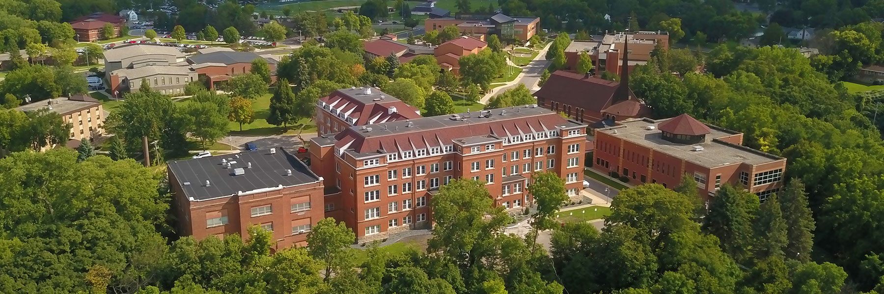 Aerial View of campus from valley in front of Old Main looking back towards Marsh & Division Streets