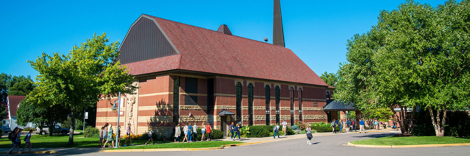 People walking on campus outside of Trinity Chapel