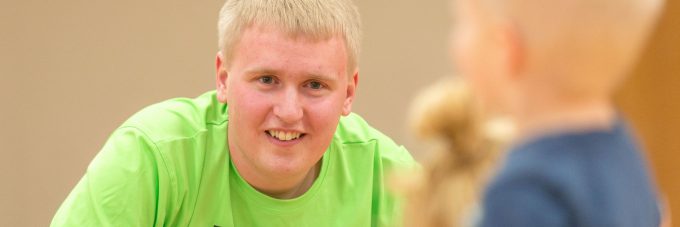 male student in bright green shirt