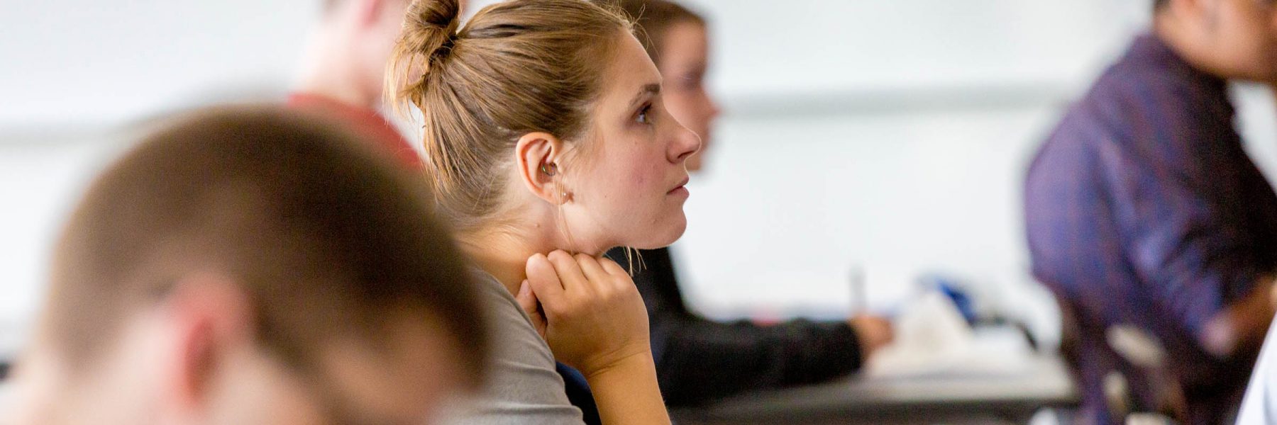 Female student listens during class