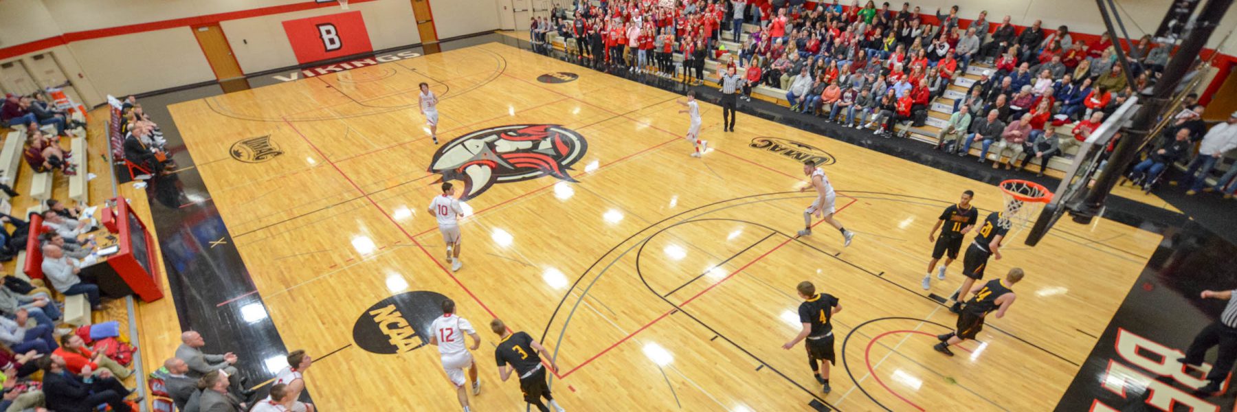 Basketball team during game in North Gym of Sports and Fitness Center