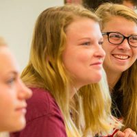 Female students in sign language class