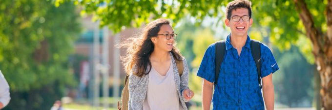 Students talking outside while walking