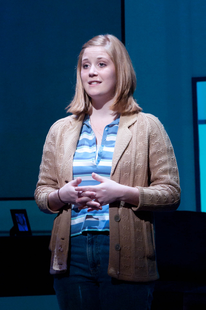 female actor on stage speaking lines