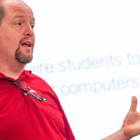 Professor Jon Loging teaching in class.