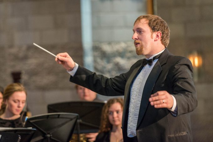 Professor of Music Benjamin Faugstad directing the musicians in the chapel