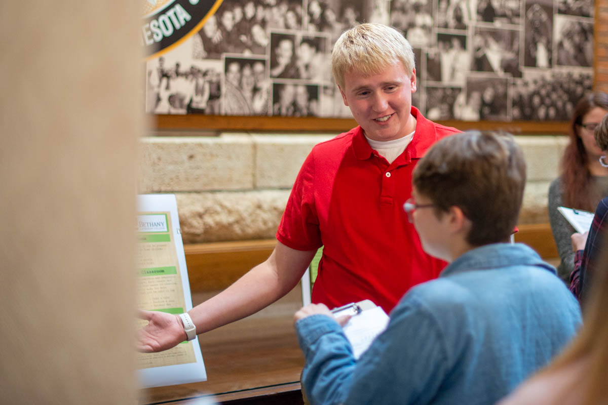 Noah Battenfeld explains his psychology poster to a judge