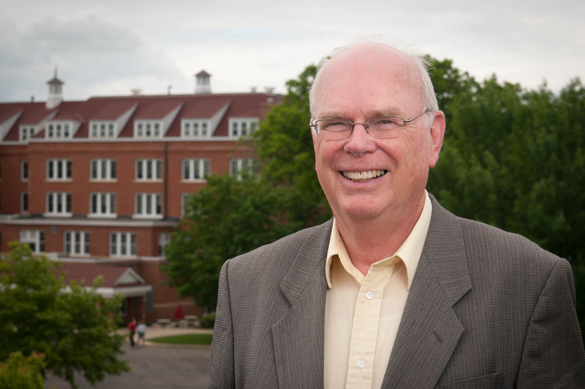 Tom Kuster with Old Main in background