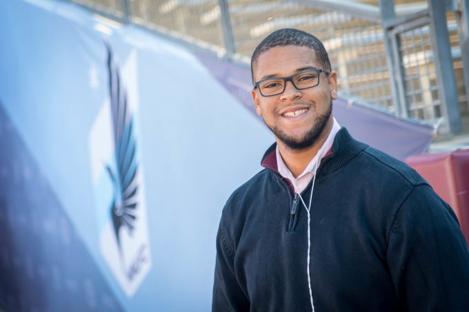 Bethany alumnus Isaac Rice poses for a photo outside Allianz field