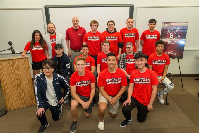 Esports group photo in front of white board