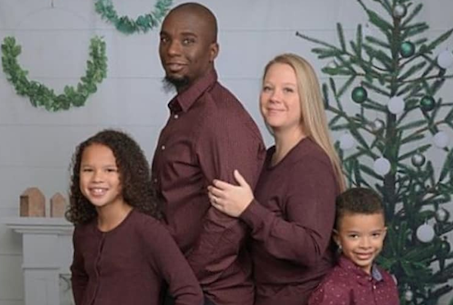 Family photo of man, woman, daughter, son