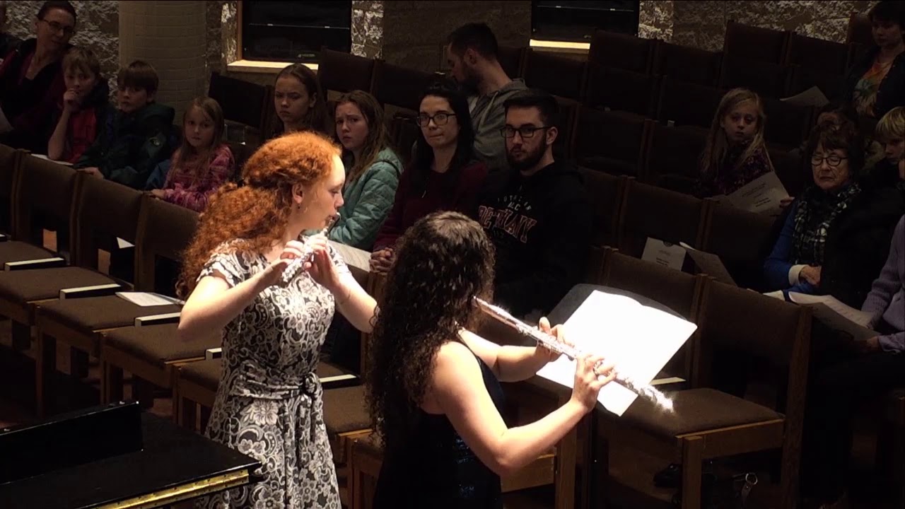 Students perform a flute duet at the 2018 Fall Honors Recital as the audience looks on.