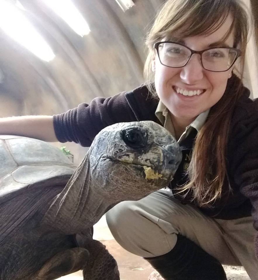 Photo of Rebecca Jahns and a large tortoise