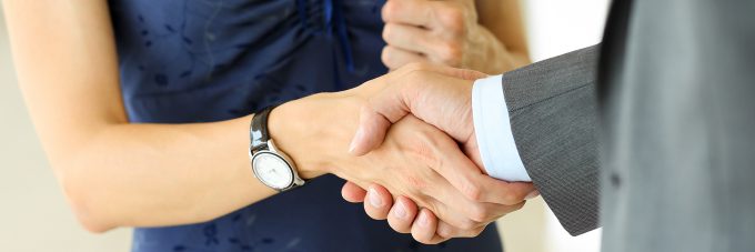 two people shaking hands