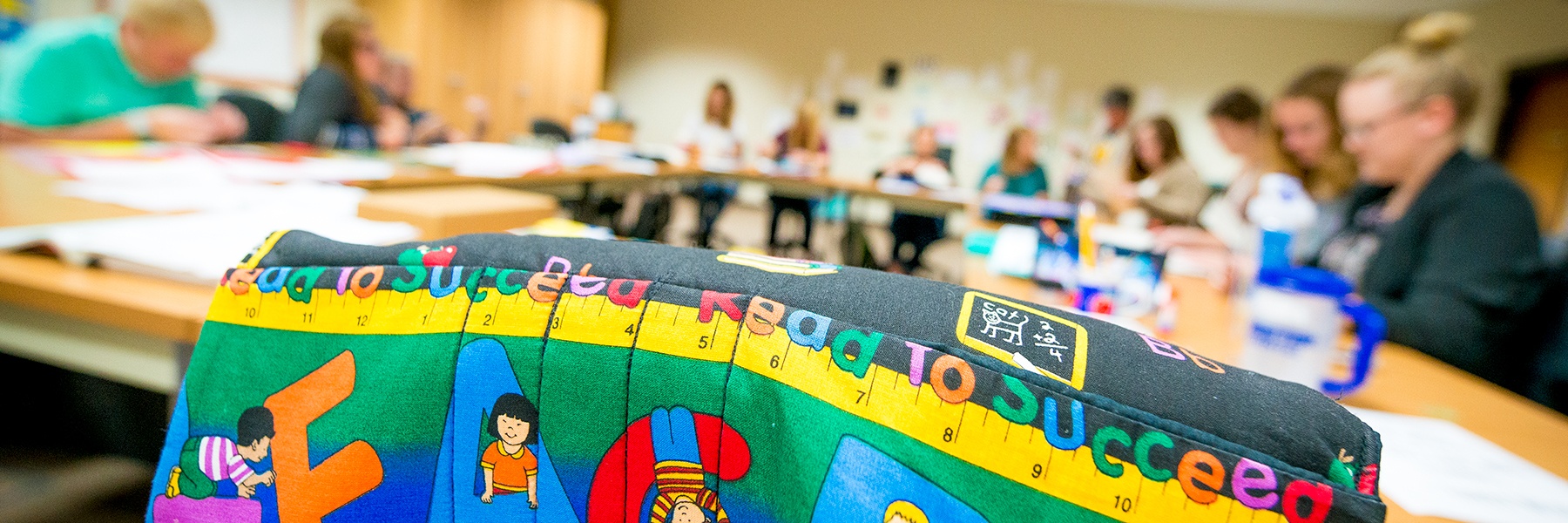 Elementary Education classroom with students at their desks working a project.