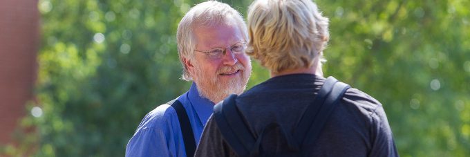 Photo of Mark DeGarmeaux talking with student