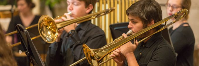 band students play their instruments in a concert