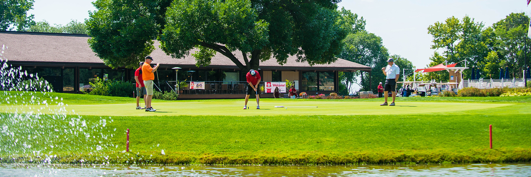 golfers putting on a golf course during a tournament