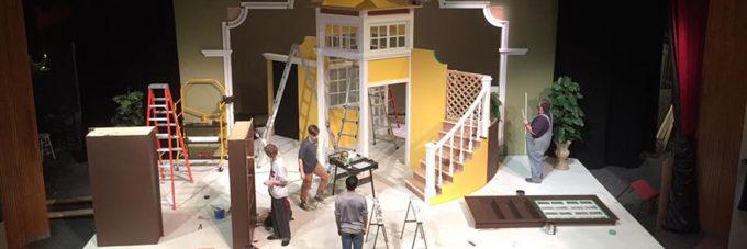 Students working on constructing a set for a theatre presentation