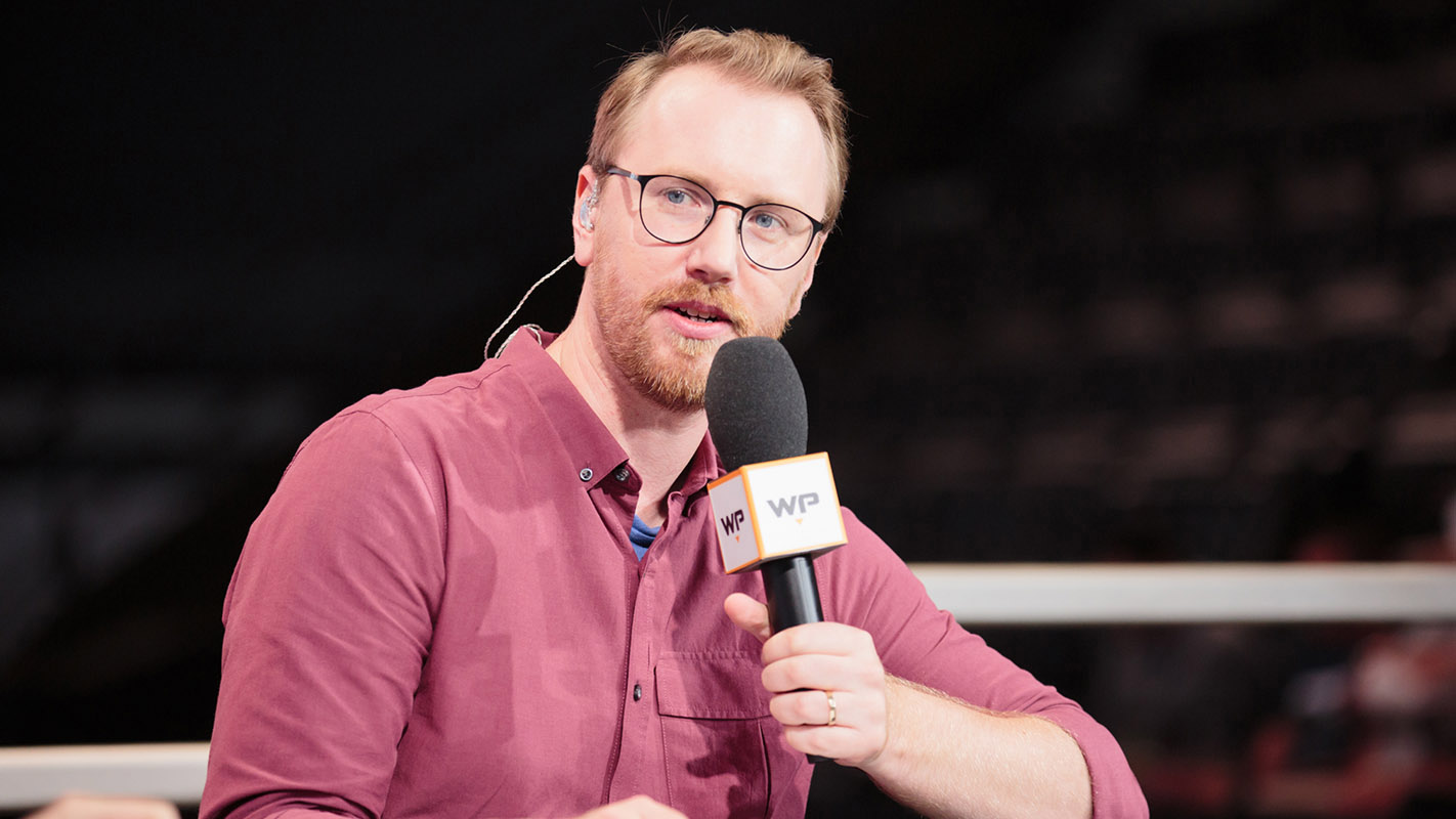 Esports caster Erik "DoA" Lonnquist speaking into a microphone