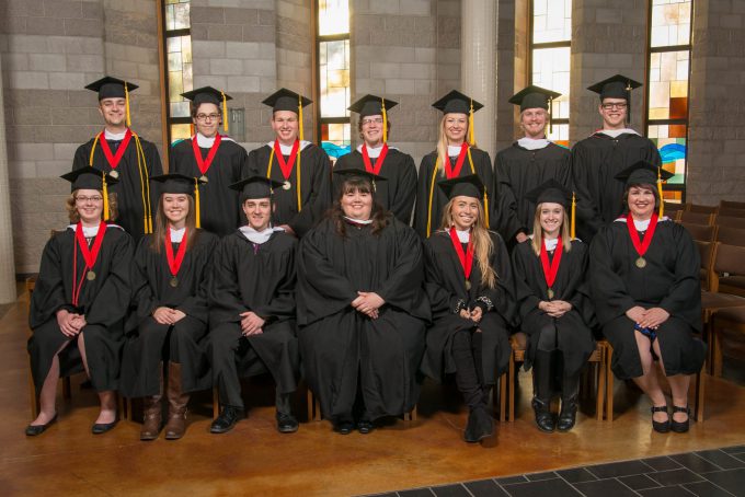 The graduating class of Fall 2017 poses for a photo in Trinity Chapel just before the commencement ceremony begins.