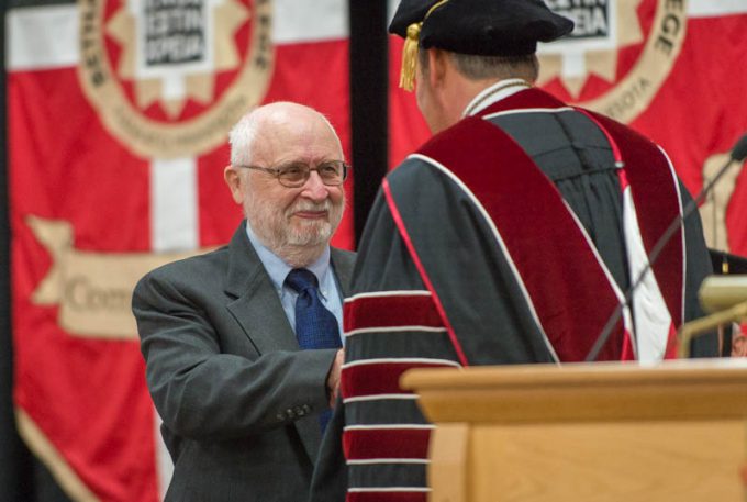 Darwin Beck receives the Distinguished Alumnus Award from Bethany President Gene Pfeifer during the 2019 Spring Commencement Ceremony.