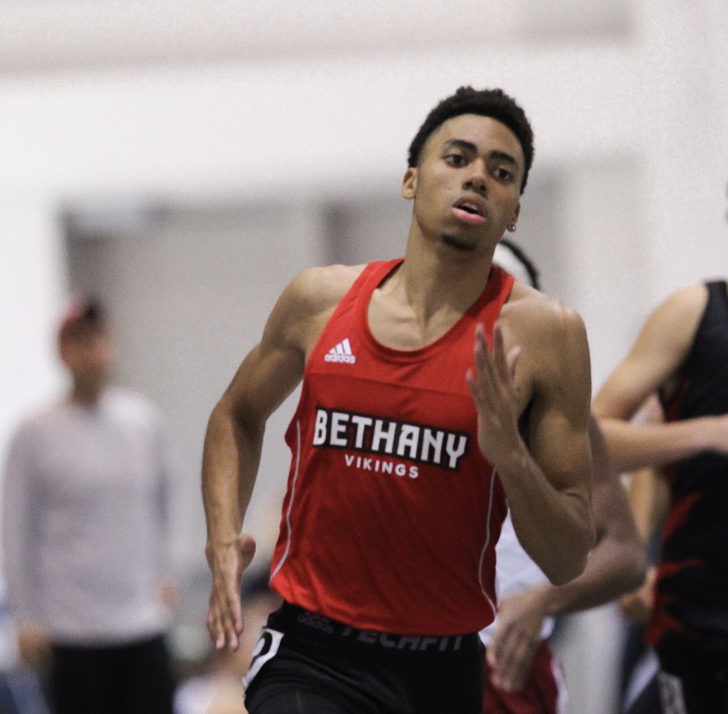 Male track and field runner in action