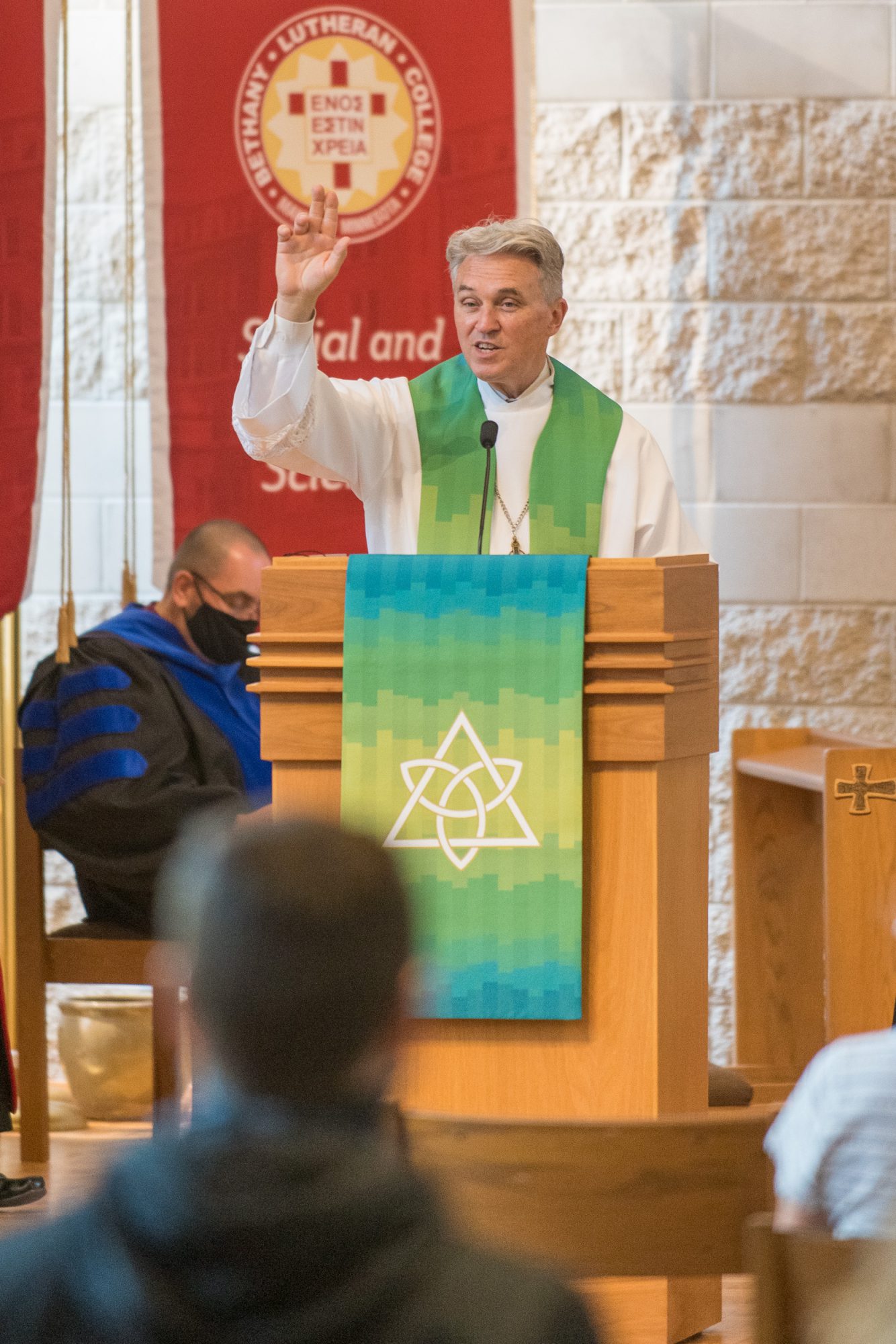 Chaplain Don Moldstad gives the blessing at the end of the service in Trinity Chapel