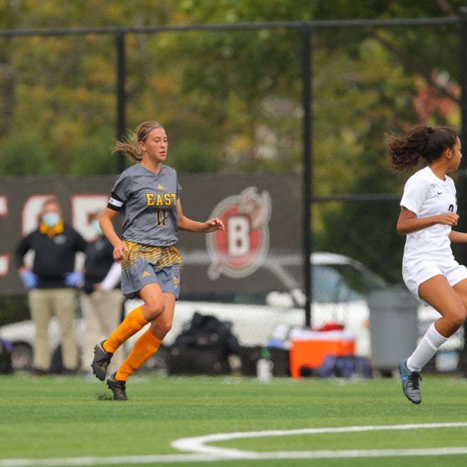 East female soccer player on Bethany artificial playing field