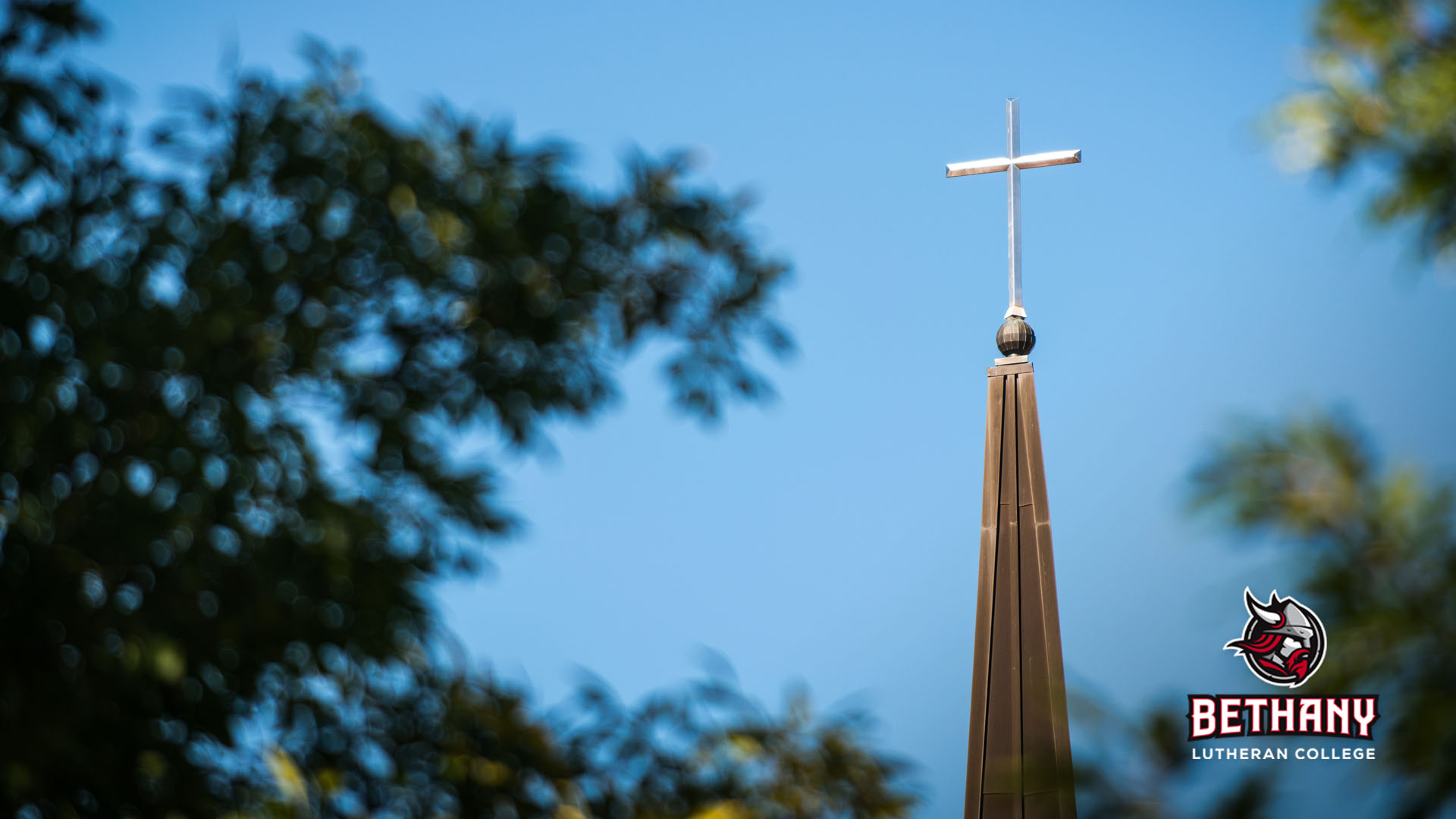 chapel steeple background, logo in lower right corner