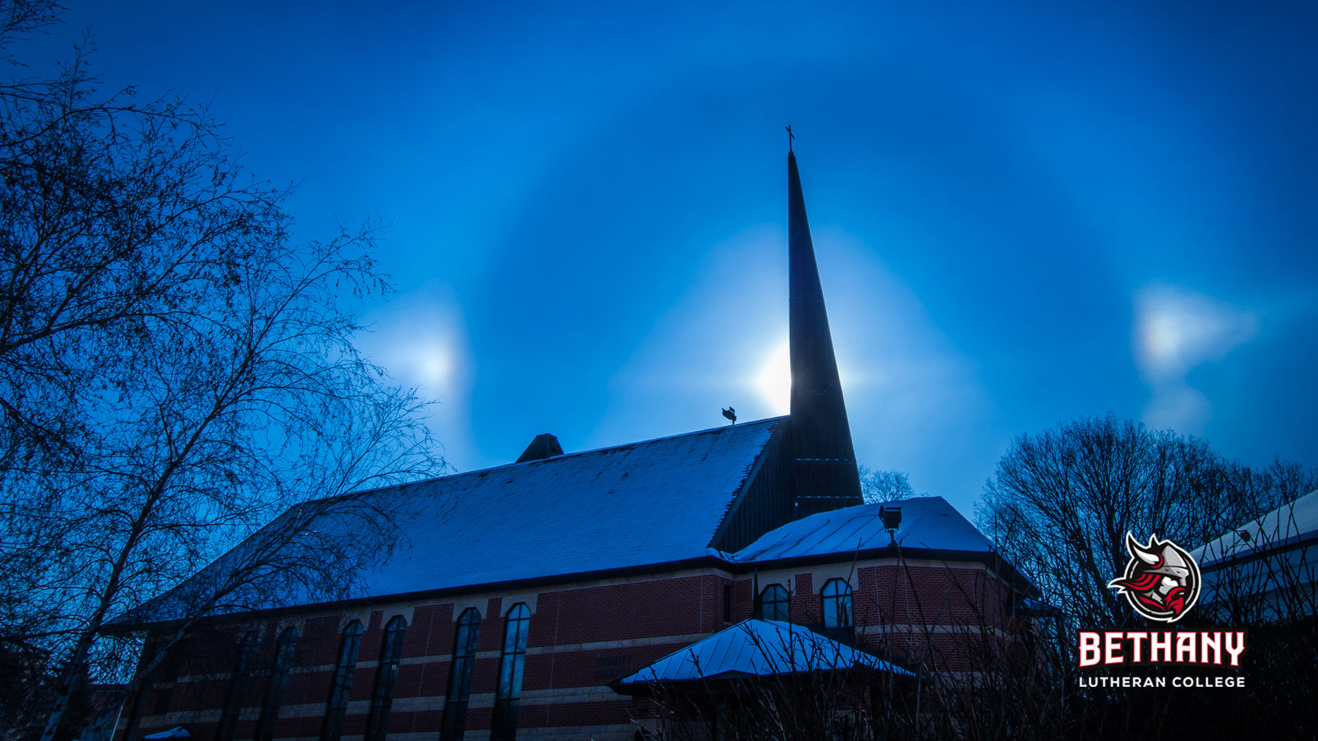 sundog above the chapel, logo in lower right corner