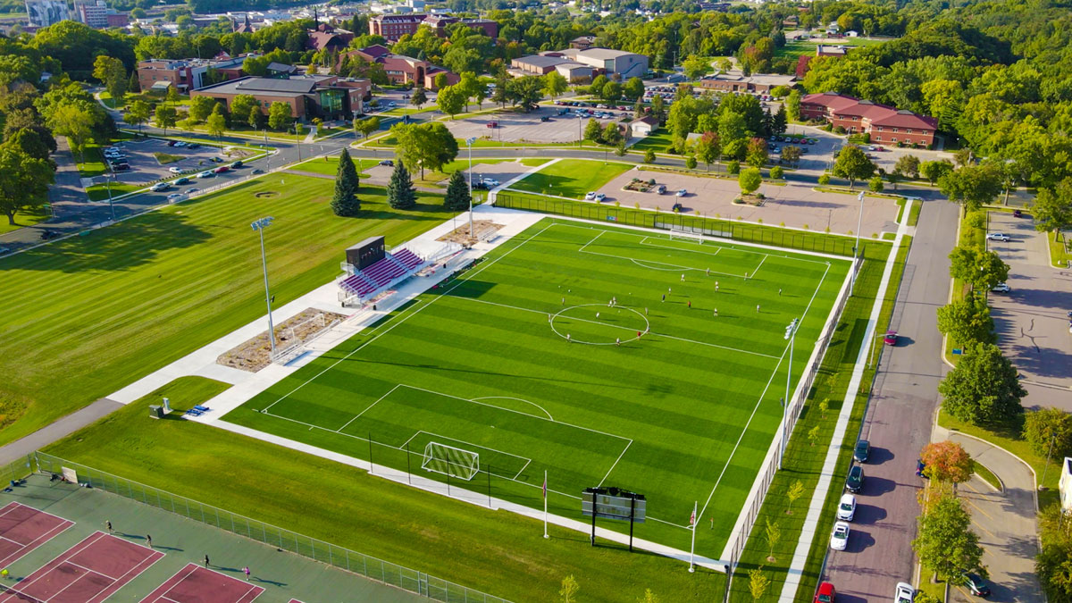 bethany soccer field from above with campus buildings in background