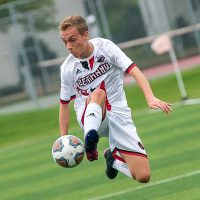 men's soccer player jumping