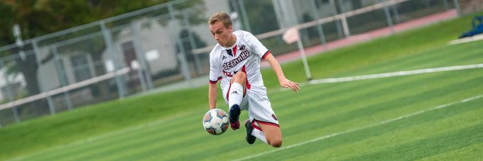 men's soccer player jumping