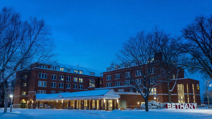 Old Main building at night with Christmas lights