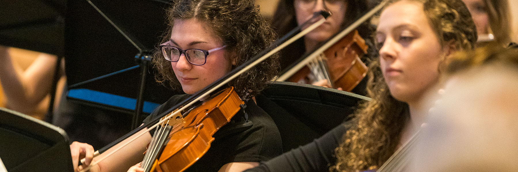 Woman playing violin during concert