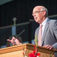 President Emeritus Dan Bruss speaking at the 2017 spring commencement ceremony