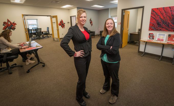 Angie Phares and Emma Morris standing in the new Career Development Center