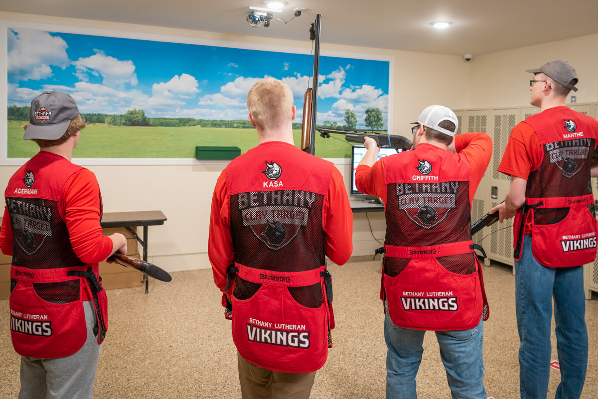 Students participate in indoor practice for clay target