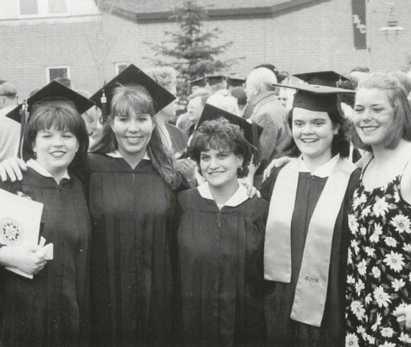 female graduates pose for group photo