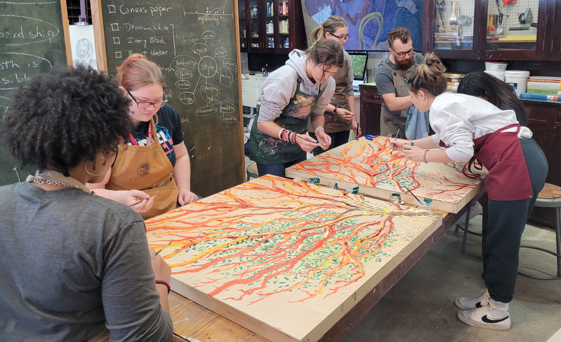 Members of the Art Service working on a painting project