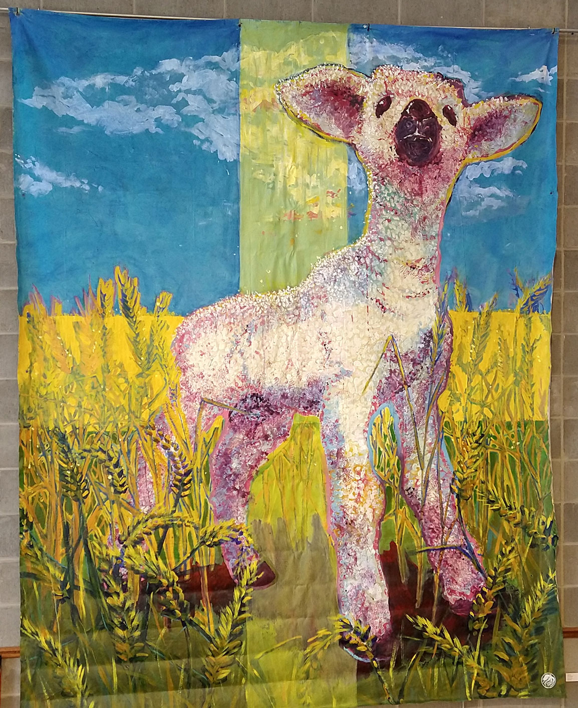 The finished painting of a lamb on display