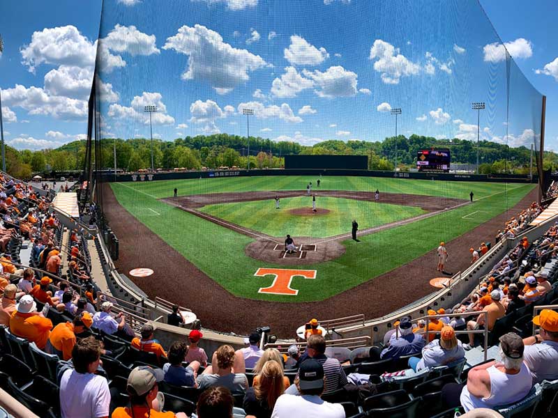 college baseball field with fans from behind home plate