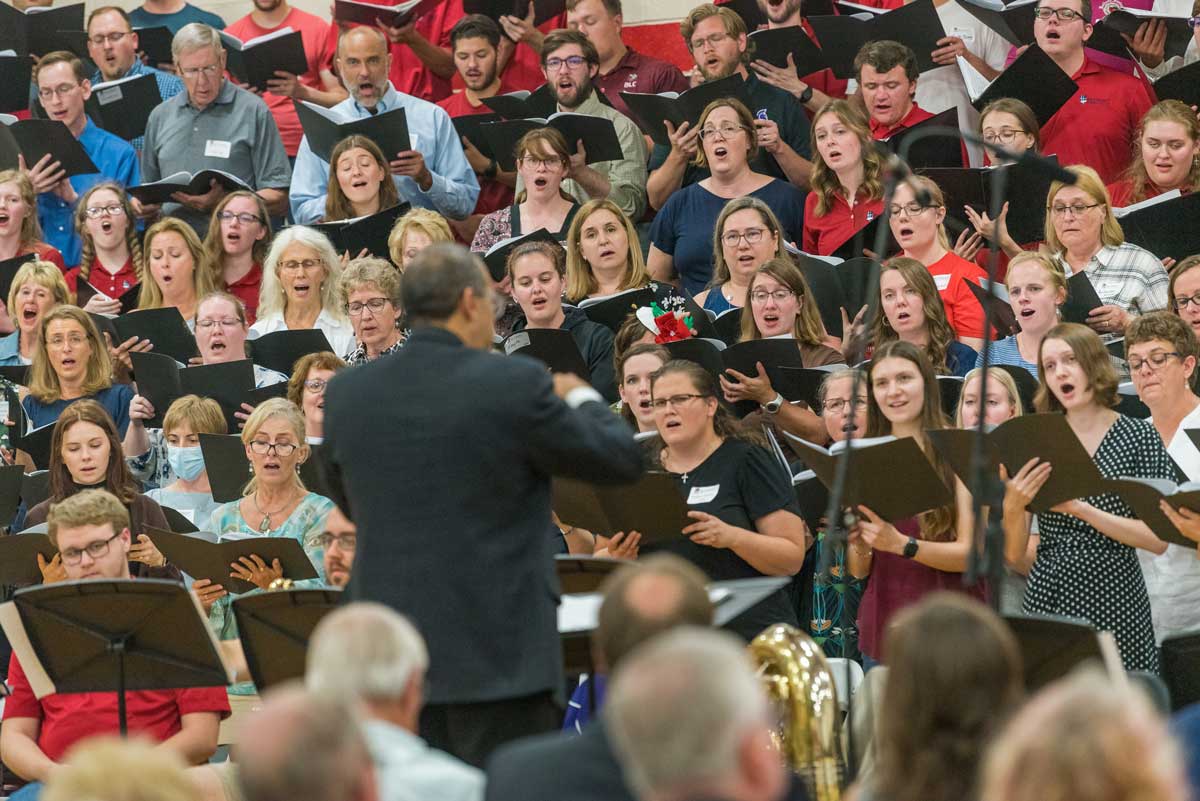 Man directing a choir, David Paulson directed during the All-Choir Reunion Concert on September 16, 2023, Bethany Magazine