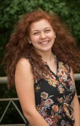 Photo of female scholarship recipient - black flowered dress